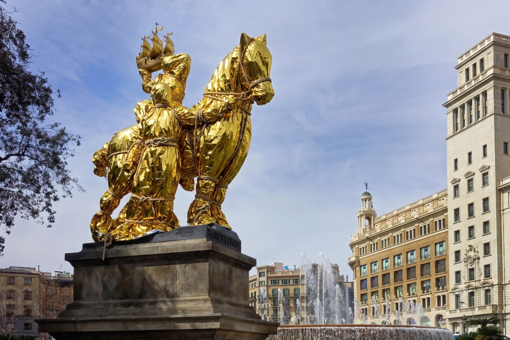 “Hermes,” a sculpture by Frederic Marès in Barcelona, wrapped in a golden thermal rescue blanket, rope, and sailor's knots.